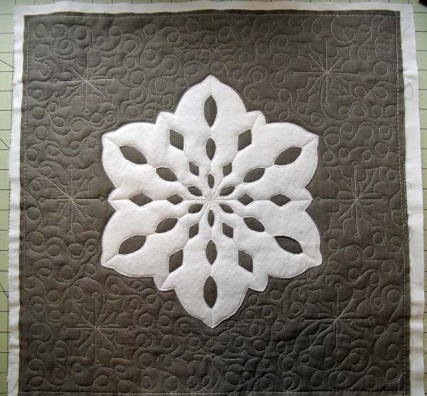 Snowflake pillow at The Crafty Quilter