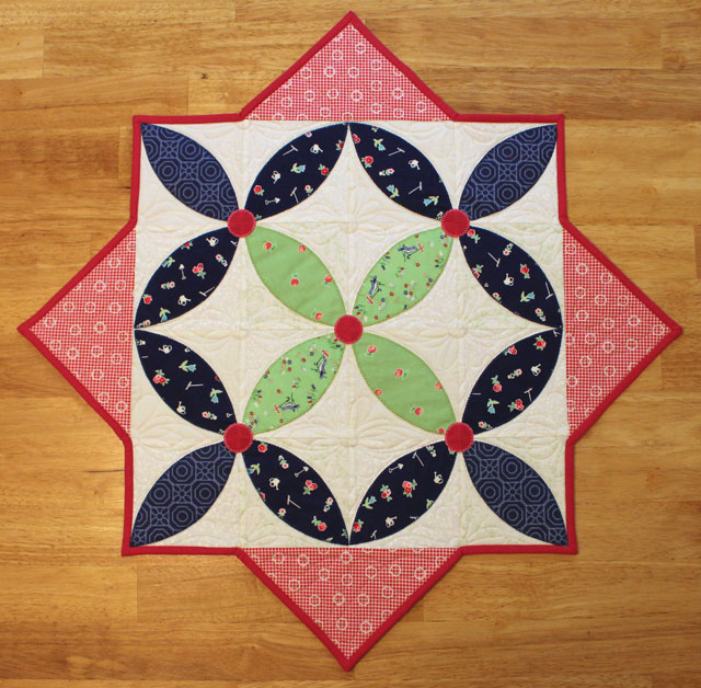 Spring Petals Table Topper by Julie Cefalu @ The Crafty Quilter