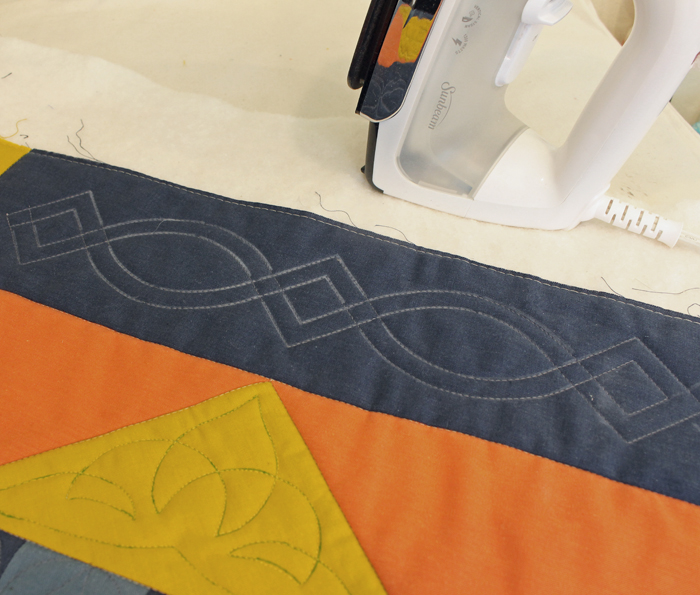 Everything you need to know about how to use stencils for quilting. Lots of tips and information about choosing the best size, marking, and stitching from Julie @ The Crafty Quilter