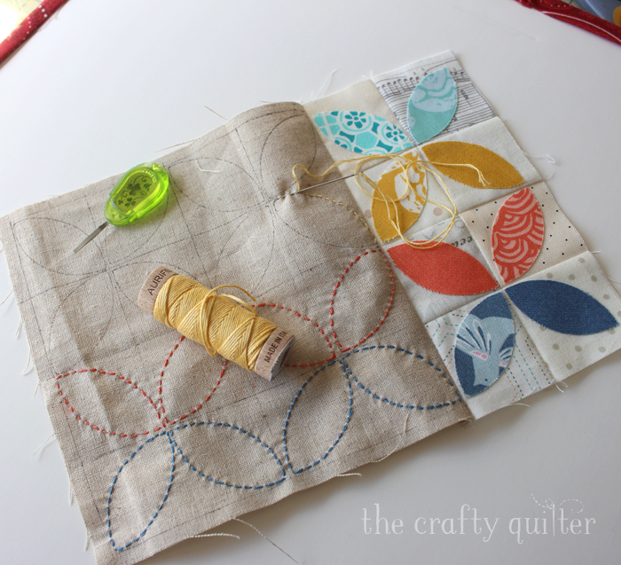 The Orange Peel Mug Rug makes a perfect gift and I have a tutorial that shows you how to make your own using a little bit of applique and embroidery. Get all the details at The Crafty Quilter.