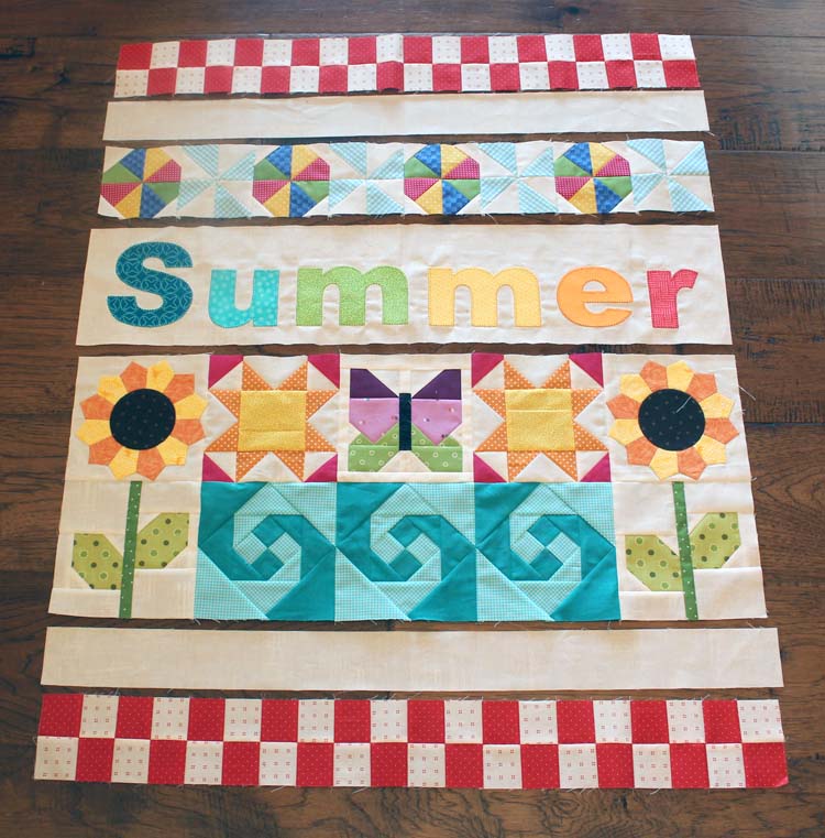 The Summer Fun Quilt Along @ The Crafty Quilter creates a bright and happy wall hanging that measures 30" x 32". Week 5 instructions include the SUMMER applique section and finishing instructions.