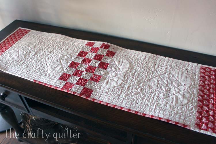 Woven Hearts Table Runner designed and made by Julie Cefalu @ The Crafty Quilter