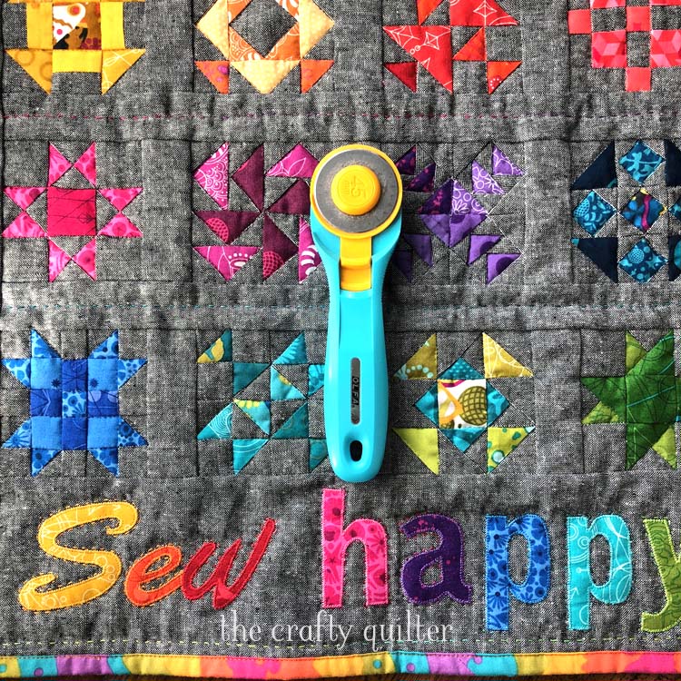 Sew Happy Mini Quilt Tutorial (free) by Julie Cefalu @ The Crafty Quilter. Finished quilt size is 18 1/2" x 17" and the quilt blocks are 3".