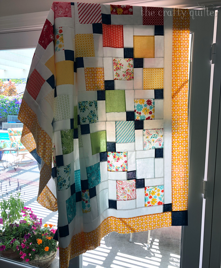Disappearing 9-patch quilt made by Julie Cefalu @ The Crafty Quilter