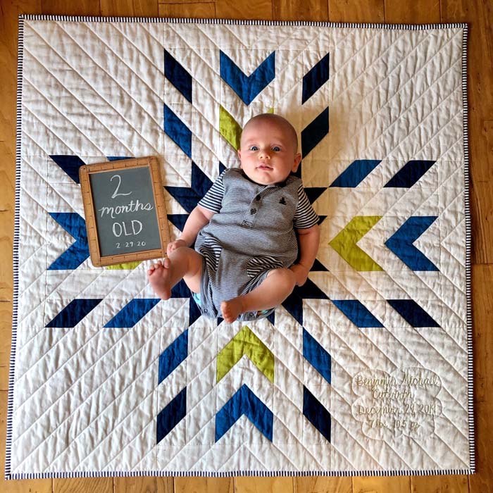 Baby Benjamin on baby quilt made by Julie Cefalu.  Pattern is Glacier Modern Quilt by QLT Studio.