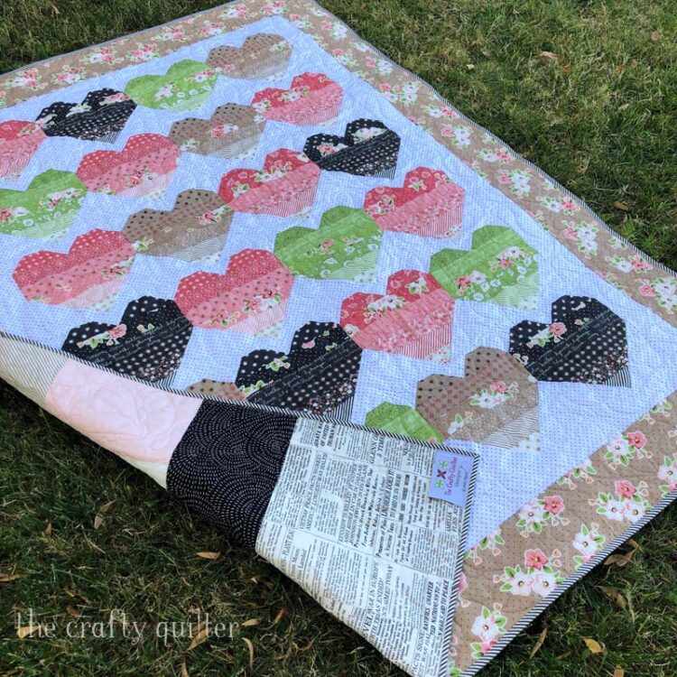 Ombre Love Quilt and pattern by Julie Cefalu @ The Crafty Quilter using a layer cake of Olive's Flower Market by Lella Boutique for Moda Fabrics