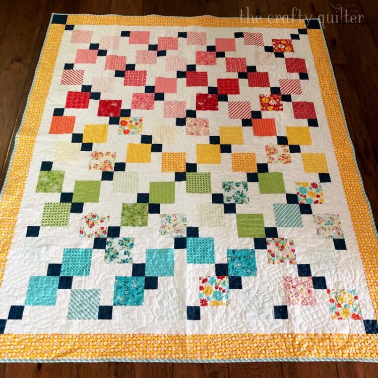 Quilt made by Julie Cefalu @ The Crafty Quilter for her Disappearing 9-patch quilt along.