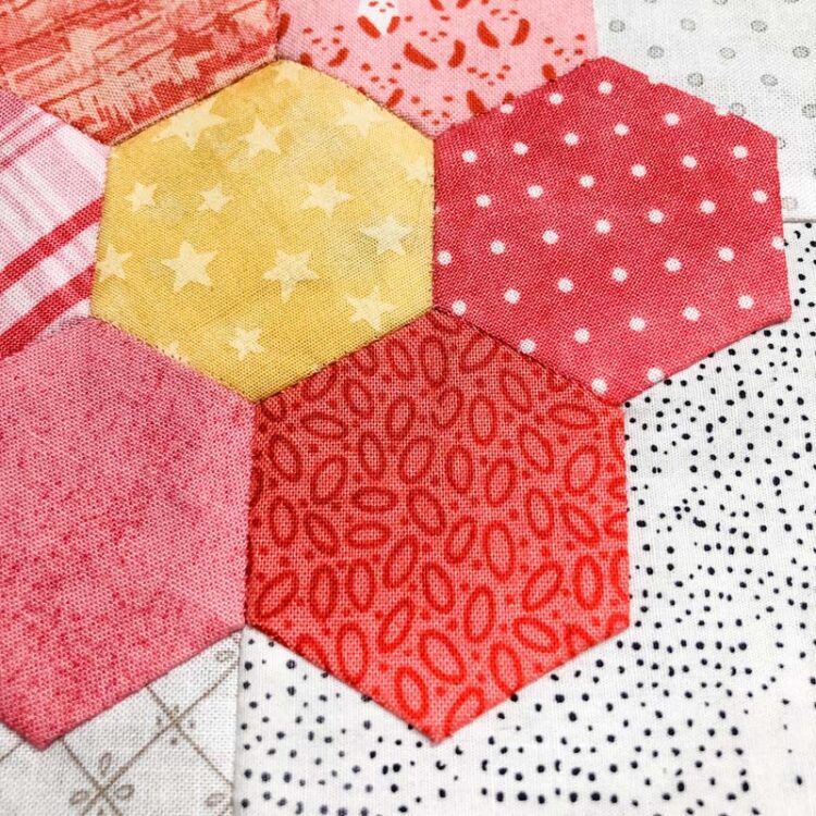 My stitches disappear with 80 wt. Quilter's Select thread on these English Paper Pieced hexagon flowers @ The Crafty Quilter