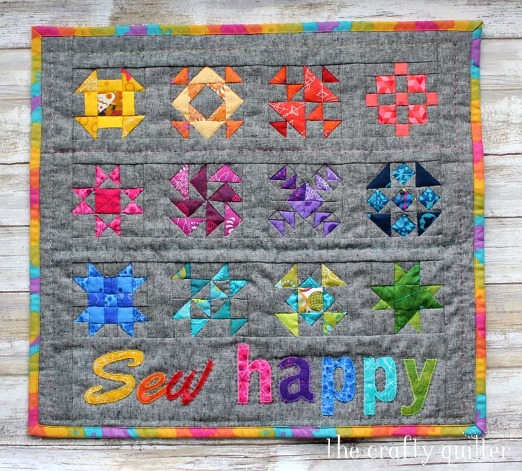 "Sew Happy" is a Free Modern Mini Quilt Pattern designed by Julie Cefalu from The Crafty Quilter!