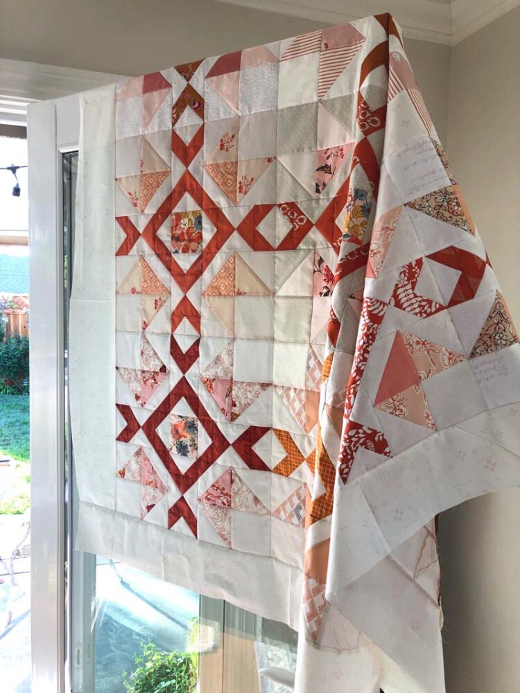 Arrow Stone QAL Week 8 has tips for finishing a quilt.  Arrow Stone Quilt made & designed by Julie Cefalu. Plus check out some beautiful finished quilt tops made by participants!