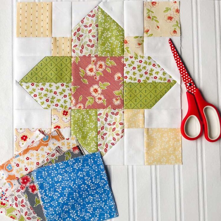 Vinca Quilt Block Tutorial @ The Crafty Quilter.  This is a 12" finished quilt block and easy to make! Can be made with 5" charm squares like this one.