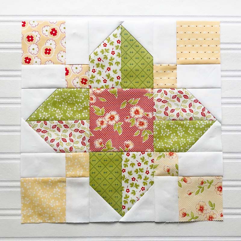 Vinca Quilt Block Tutorial @ The Crafty Quilter.  This is a 12" finished quilt block and easy to make! Can be made with 5" charm squares like this one.