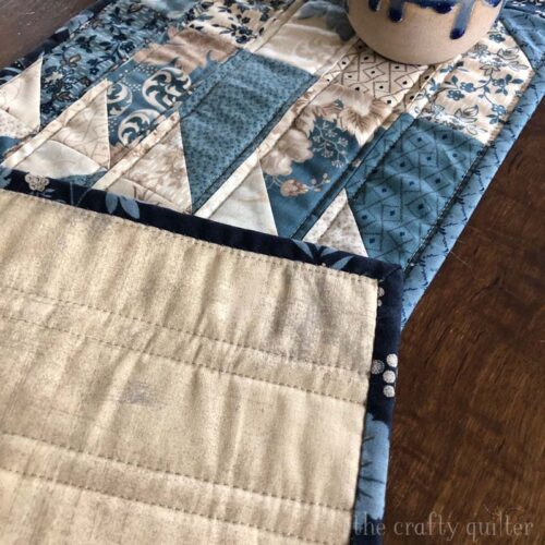 Parallel lines on each side of the seam makes this table runner a breeze to quilt.