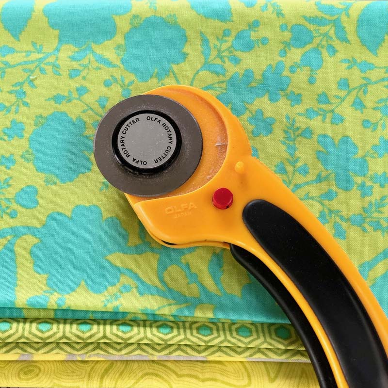 Fabric dust can collect on a rotary cutter. And never leave a rotary cutter open with an exposed blade!