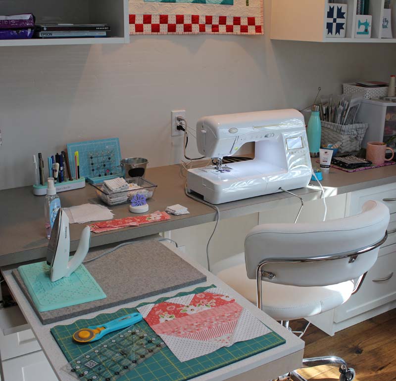 Sewing room with built in cabinets @ The Crafty Quilter provides perfect work space for quilting and sewing.