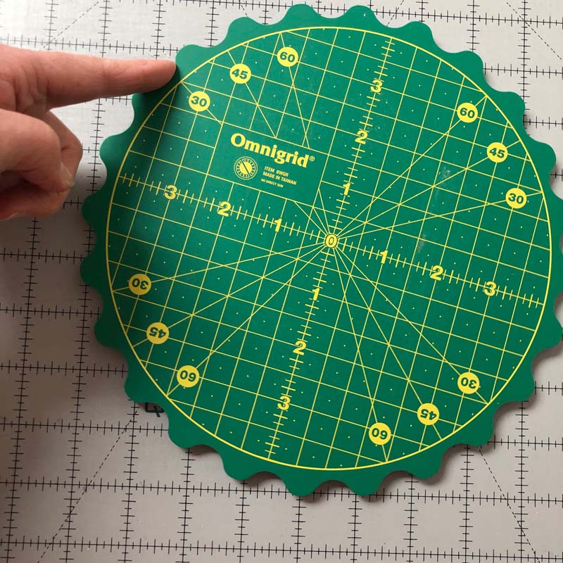 The Omnigrid Rotating Mat with Scalloped Edges is perfect for trimming HST's (half-square triangle units).