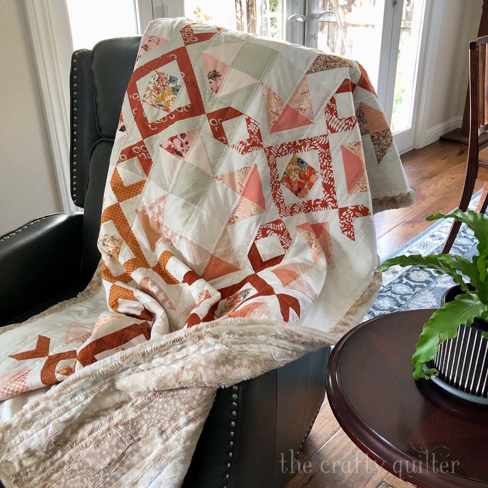 My experience and best tips for using Cuddle minky fabric for backing & binding on quilt.  Scrappy Arrow Stone Quilt designed and made by Julie Cefalu @ The Crafty Quilter.