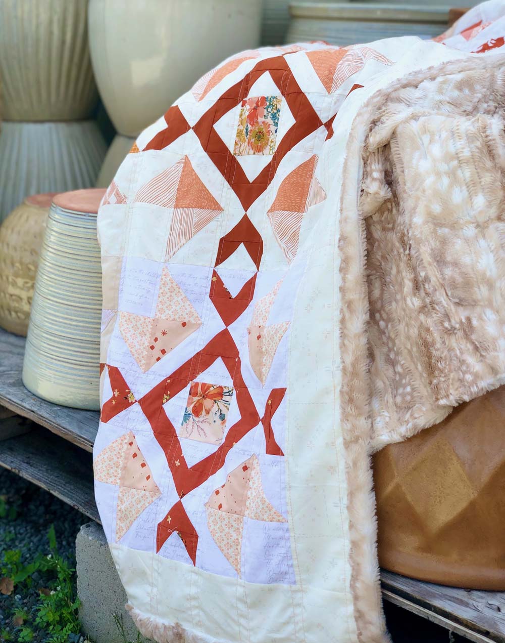 My Scrappy Arrow Stone Quilt got to join me at the local garden center for some photos.  Pattern by The Crafty Quilter Designs, available on Etsy.