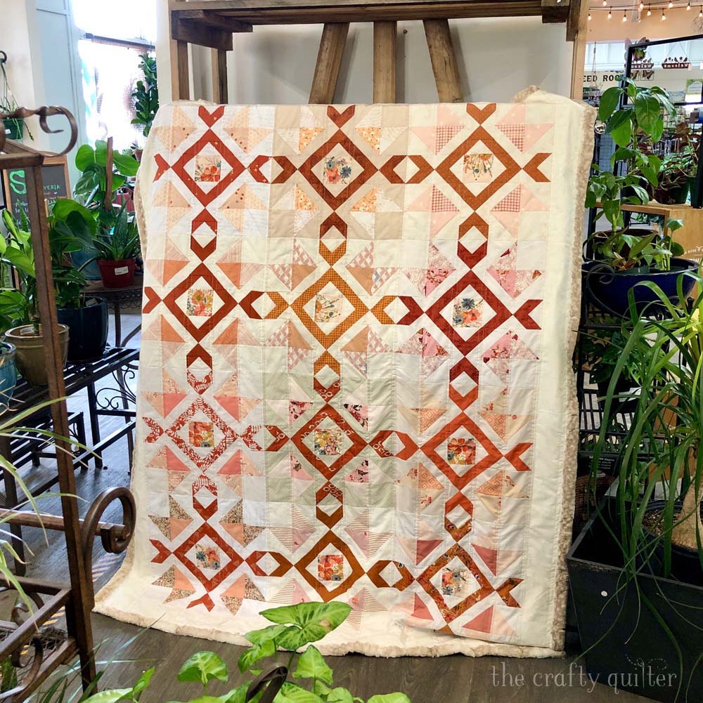 My Scrappy Arrow Stone Quilt got to join me at the local garden center for some photos.  Pattern by The Crafty Quilter.