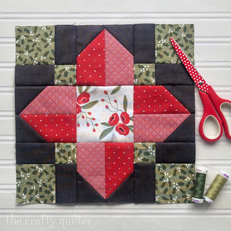 Vinca Blossom quilt block made in a Christmas version. Pattern by Julie Cefalu @ The Crafty Quilter