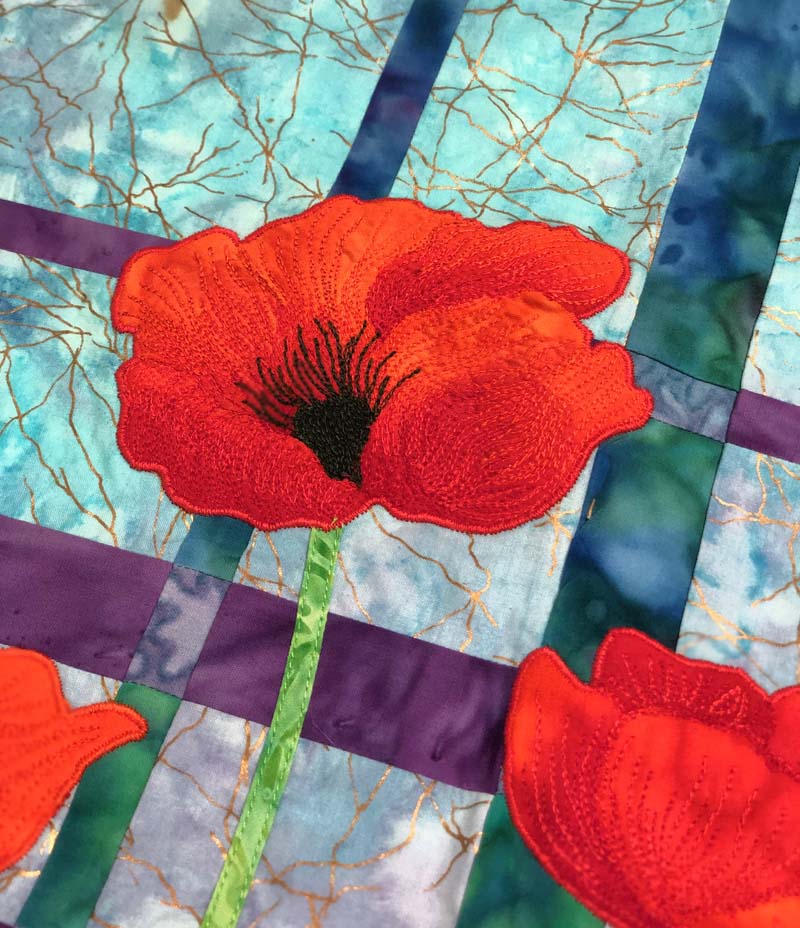 Thread painting detail of Poppy Convergence by Julie Cefalu @ The Crafty Quilter.