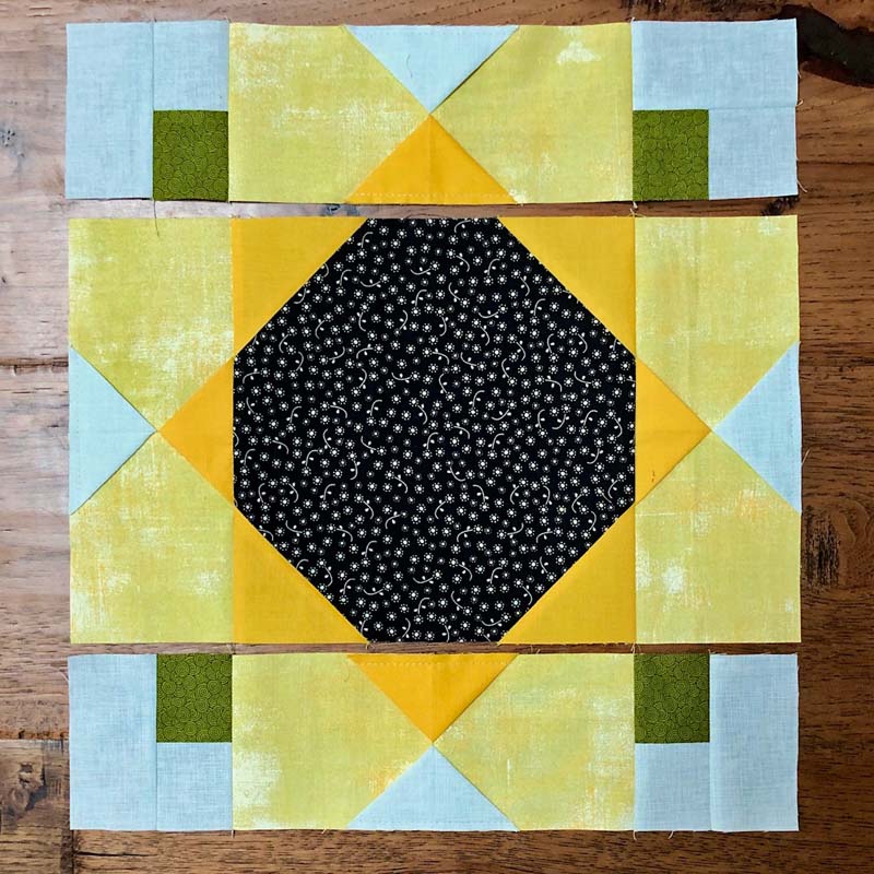 Garden Sunflower quilt block in rows @ The Crafty Quilter.