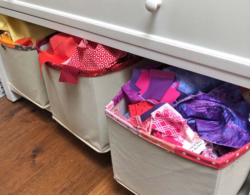 My scrap fabric bins are sorted in rainbow color. I have a full tutorial on how I made them at The Crafty Quilter. 