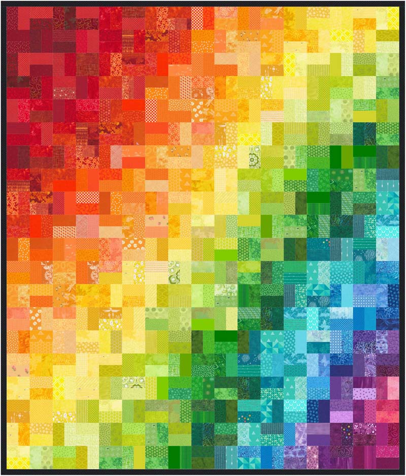 A rainbow quilt made from scraps used as leaders and enders.  Full project details at The Crafty Quilter.