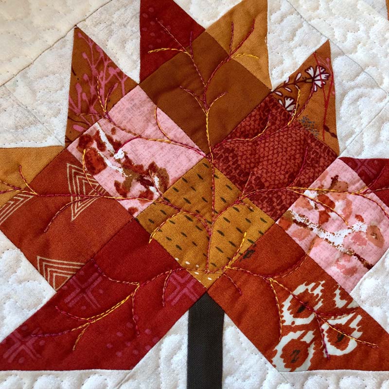 Quilting detail of the Scrappy Leaves Table Runner by Julie Cefalu @ The Crafty Quilter.