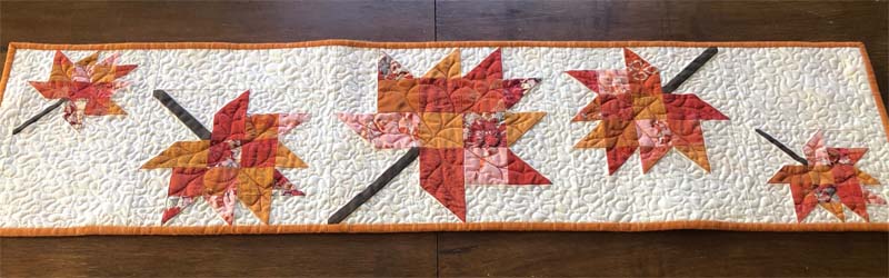 Scrappy Leaves Table Runner made & designed by Julie Cefalu @ The Crafty Quilter. Free pattern is available!