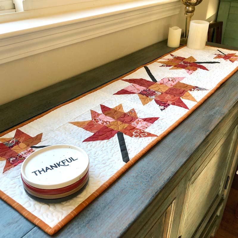 Scrappy Leaves Table Runner made & designed by Julie Cefalu @ The Crafty Quilter.