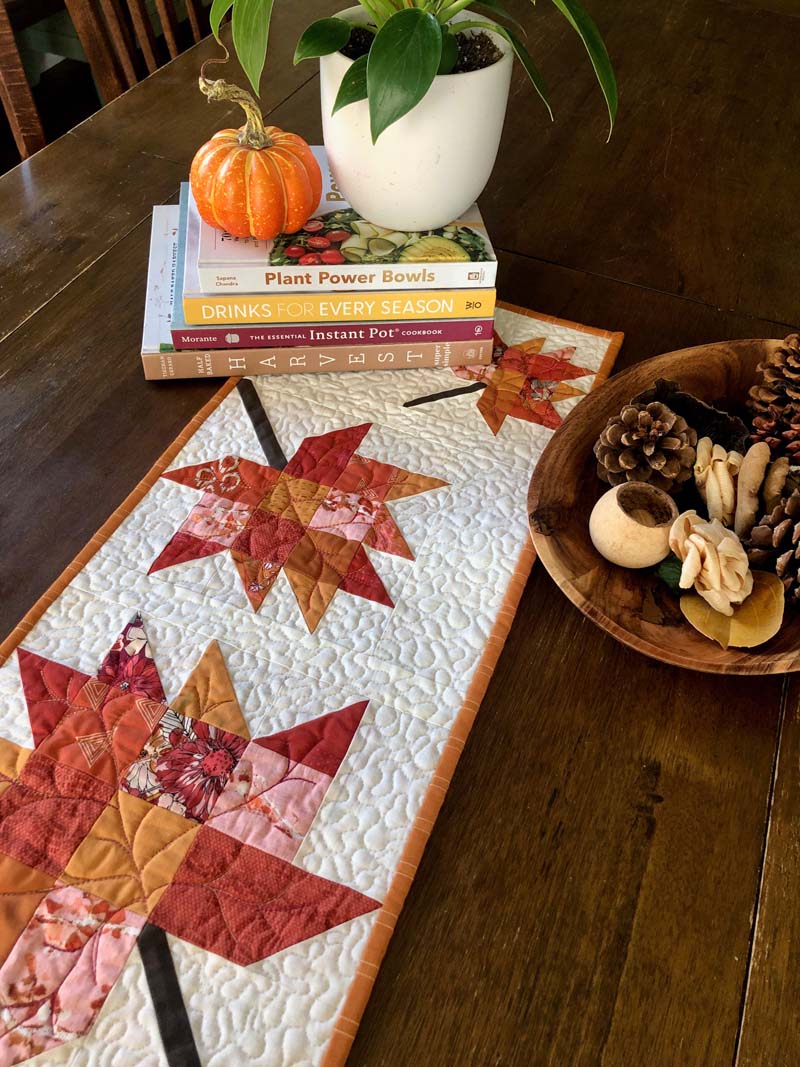 Scrappy Leaves Table Runner is a perfect way to decorate for Fall. Free pattern is available @ The Crafty Quilter.