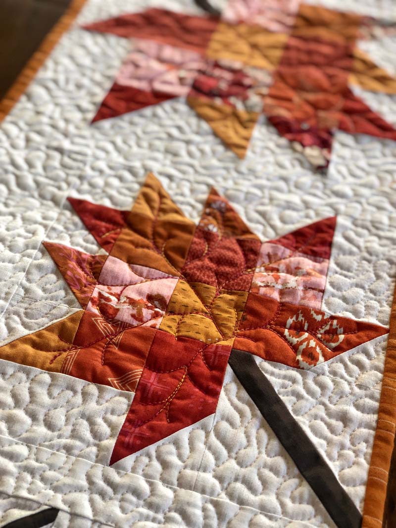 Quilting detail of the Scrappy Leaves Table Runner by Julie Cefalu @ The Crafty Quilter.