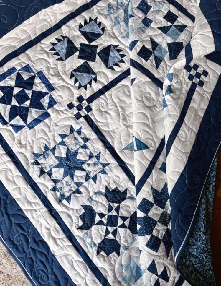 Finished quilt, made by Julie Cefalu. Pattern is Red & Cream Sampler by Fig Tree Quilts & Co.